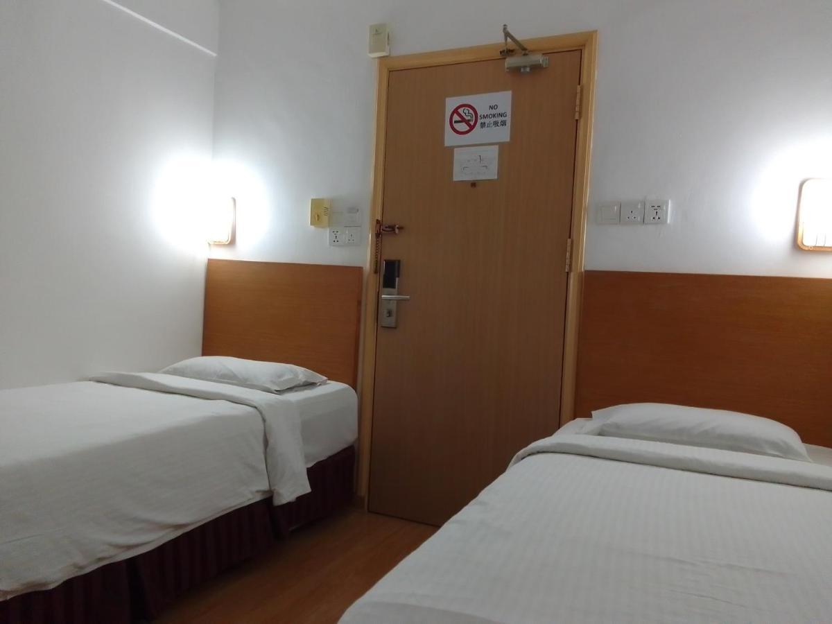 Super Oyo 90464 Borneo Suites Hotel Кота-Кинабалу Экстерьер фото
